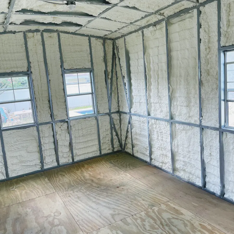 Closed-cell spray foam insulation applied to wall cavities in a residential project in Prichard